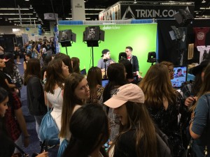Fans gather for Reed Deming, a singer/songwriter of X Factor and YouTube fame, in his interview on Chris Trondsen's show live at the Datavideo booth. 